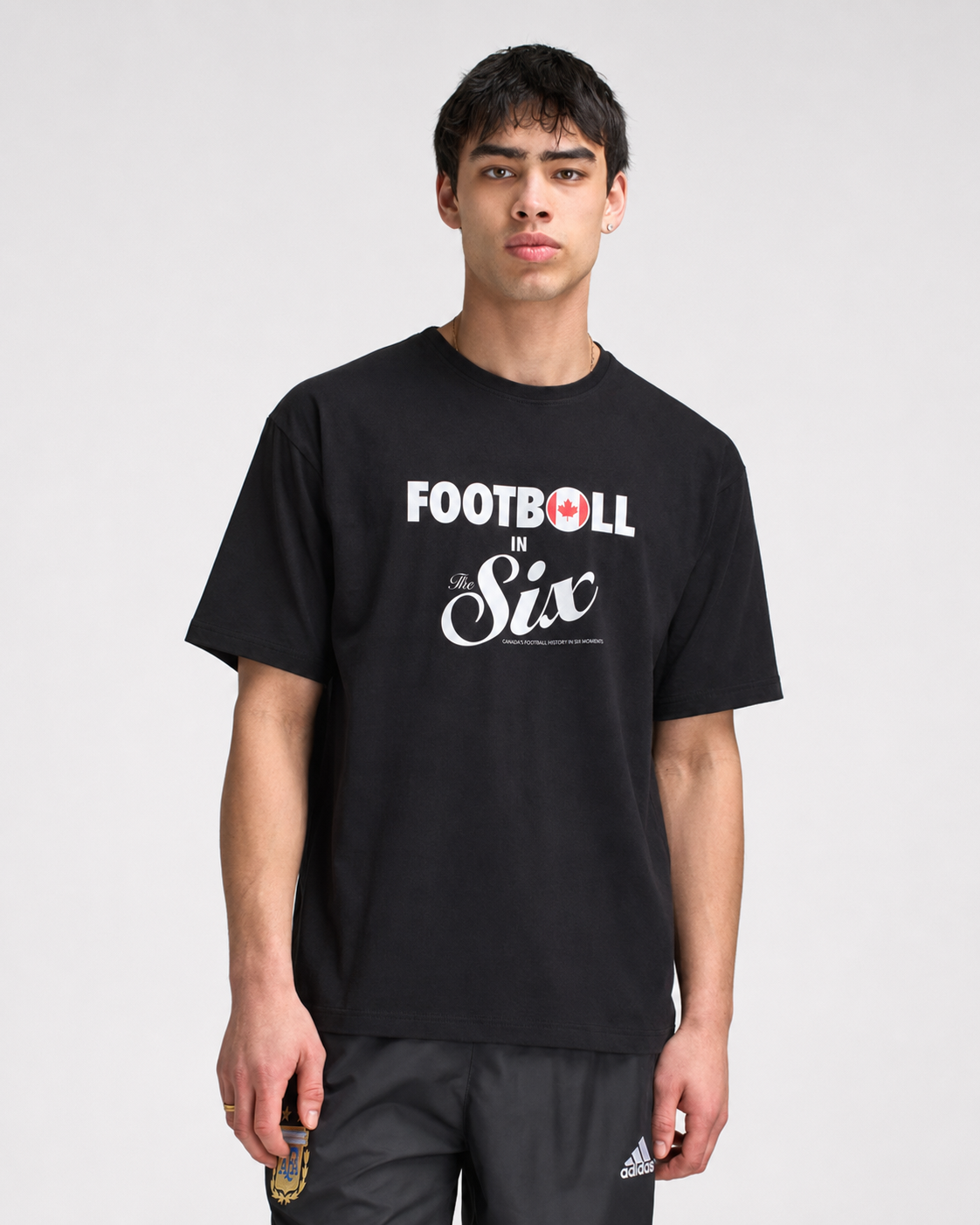 Football in The Six — Canada Football Flags Tee black model shot | Toronto 2026 Souvenir