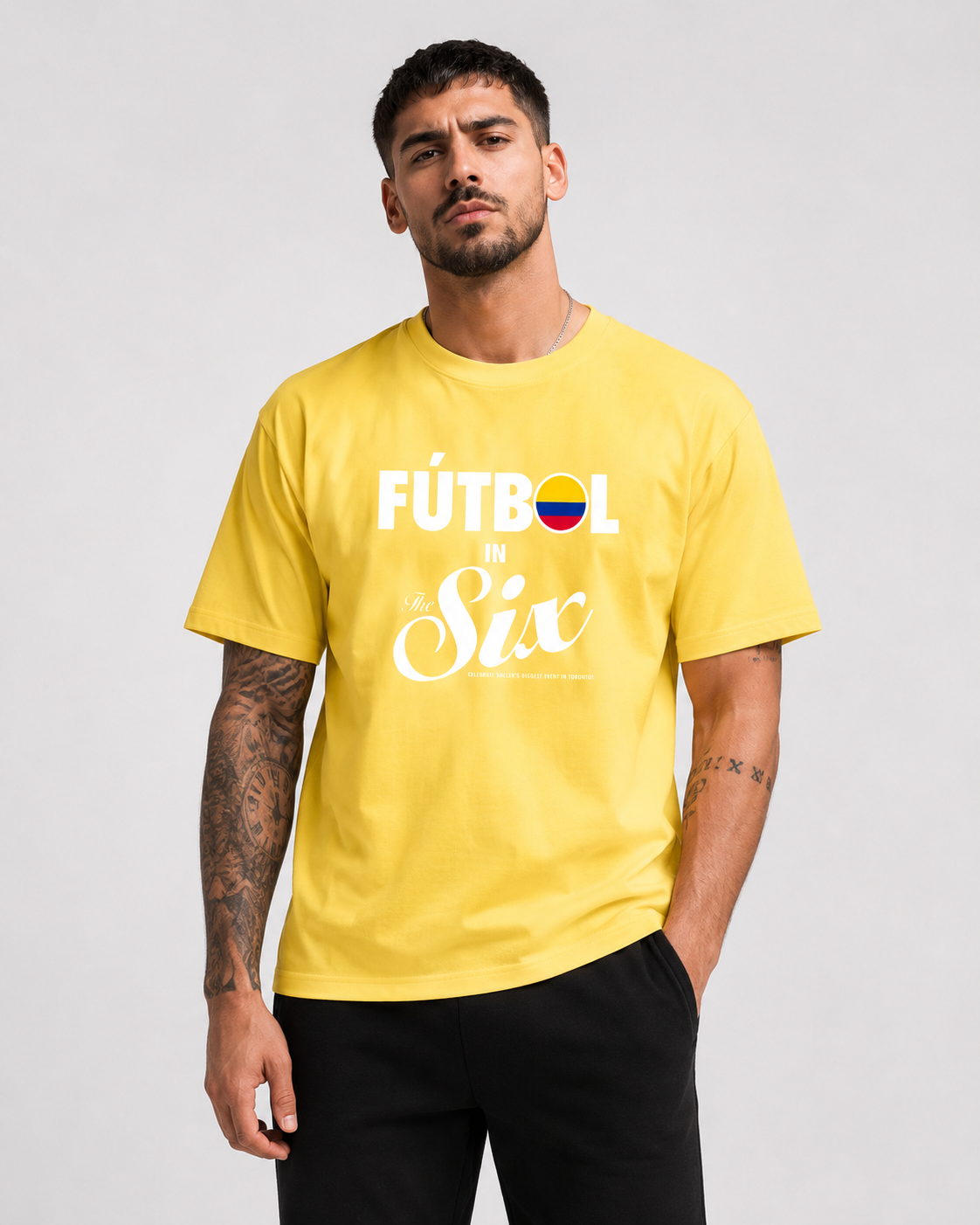 Fútbol in The Six — Colombia Football Flags Tee yellow model shot | Toronto 2026 Souvenir